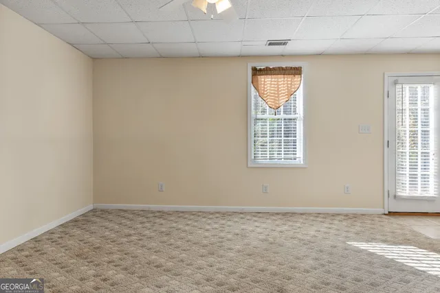 a view of a backyard with large trees
