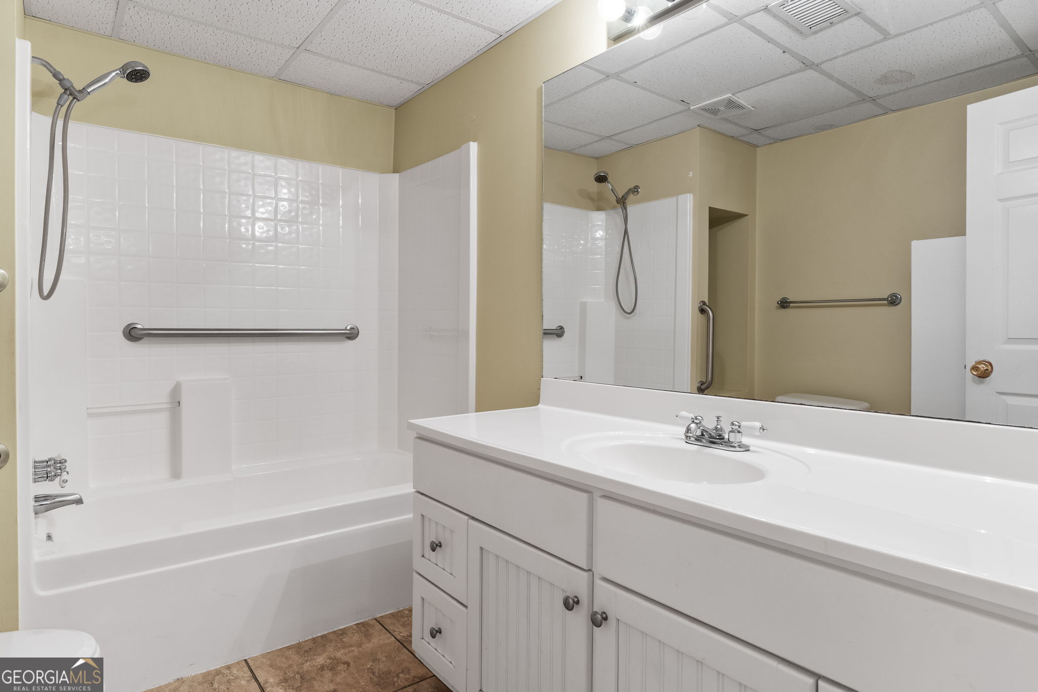 400 Moseley Road Stockbridge, GA 30281 - Photo 45 of 70 a bathroom with a sink double vanity mirror and a bathtub