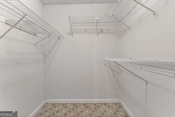 a view of a house with a yard and garage