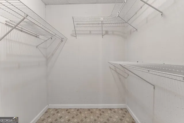 a view of a house with a yard and garage