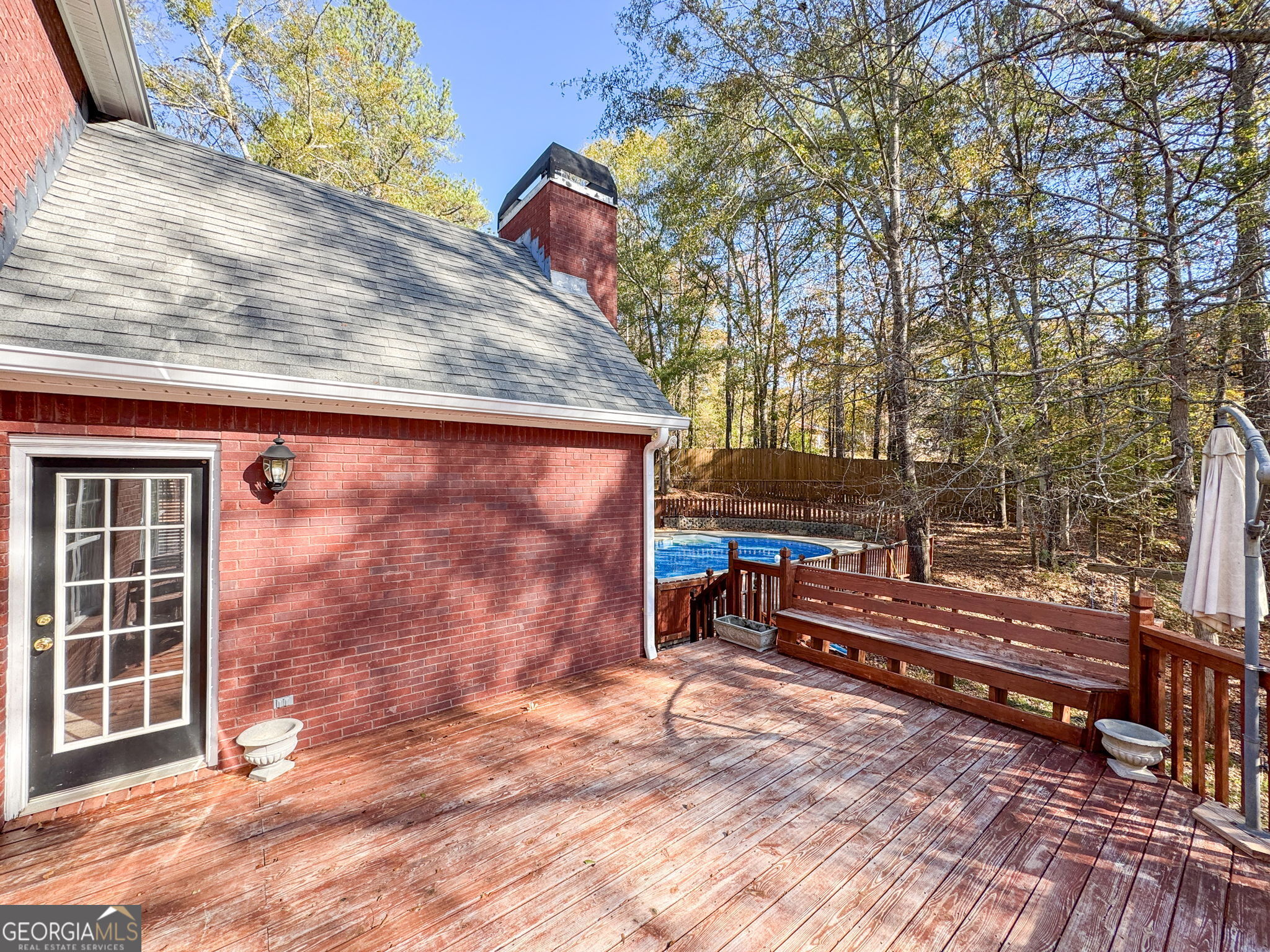 400 Moseley Road Stockbridge, GA 30281 - Photo 51 of 70 a backyard of a house with barbeque oven and trees