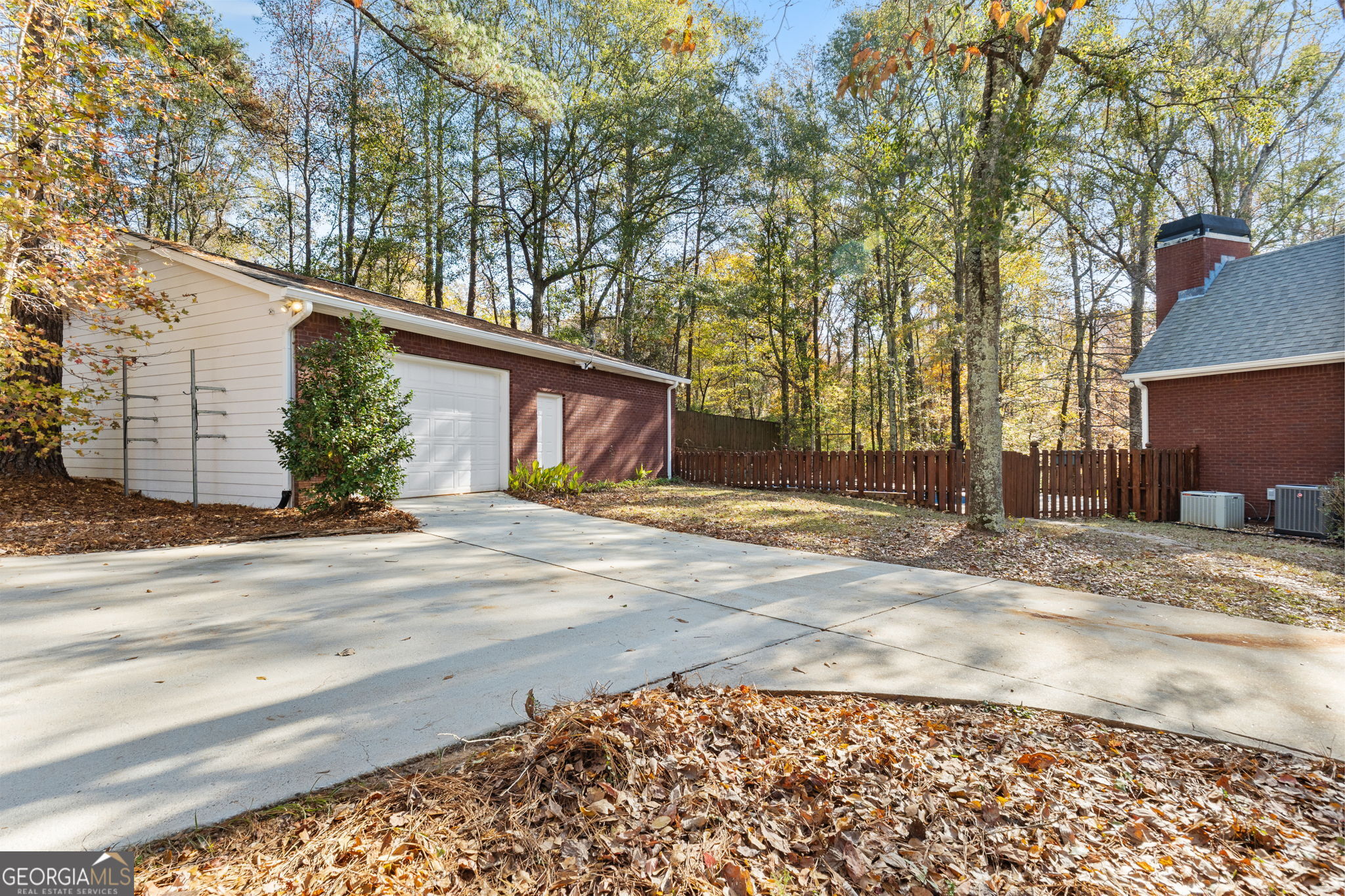 400 Moseley Road Stockbridge, GA 30281 - Photo 58 of 70 a view of a house with a yard and garage