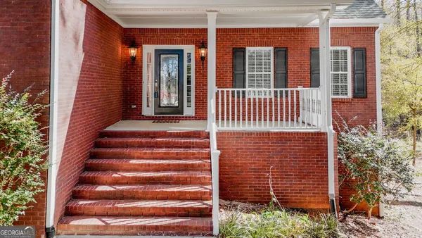 a view of a brick house with a window