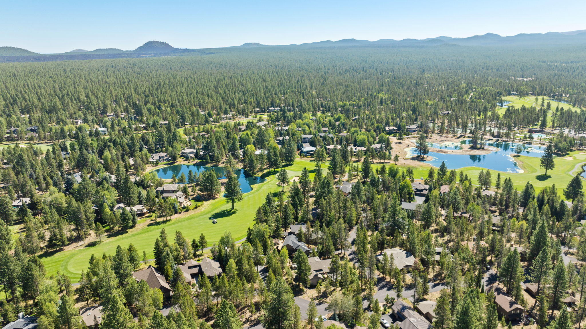 58026 Kinglet Road Sunriver, OR 97707 - Photo 39 of 39 a view of a town with mountains in the background