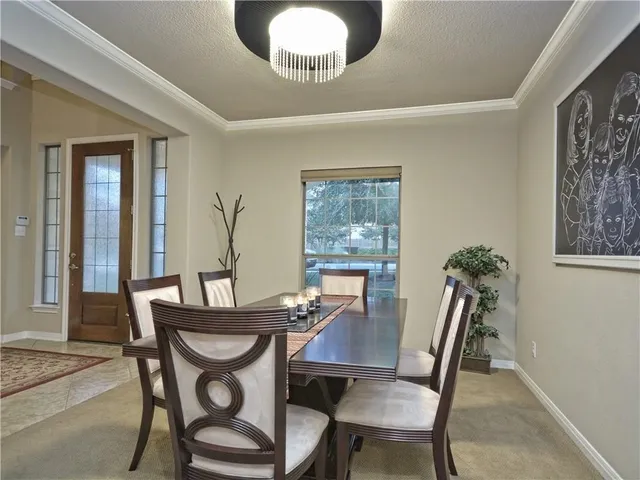 a view of a livingroom with furniture and stairs