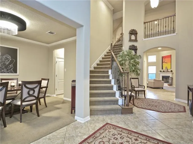 a living room with furniture and a rug