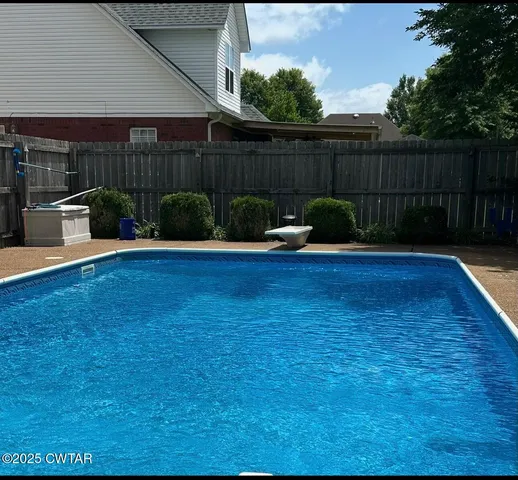 a view of a backyard with hardwood