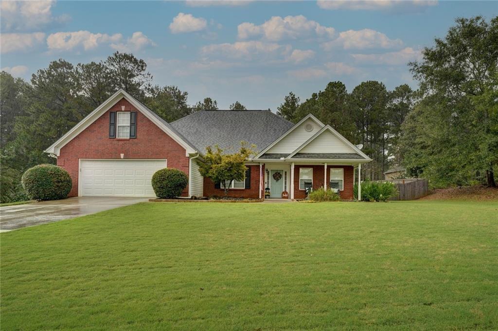 a front of a house with a garden