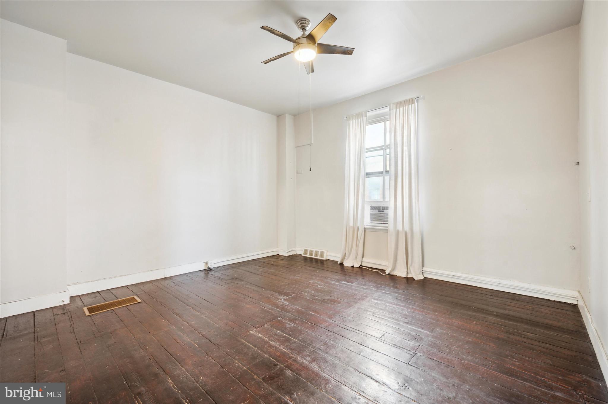162 North 3rd Street, Unit 2 Philadelphia, PA 19106 - Photo 13 of 17 an empty room with wooden floor and windows