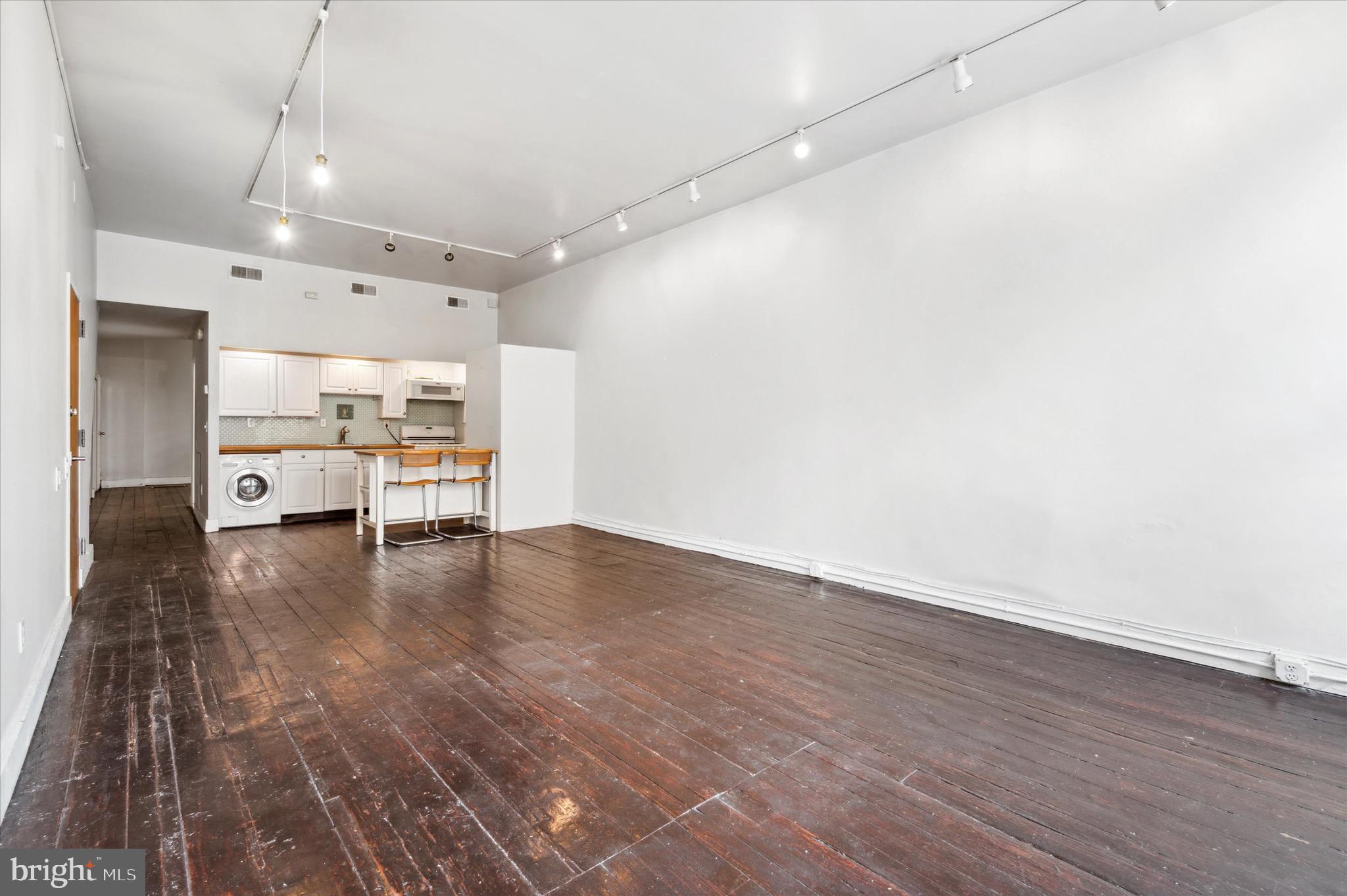 162 North 3rd Street, Unit 2 Philadelphia, PA 19106 - Photo 5 of 17 a view of a livingroom with hardwood floor and a kitchen