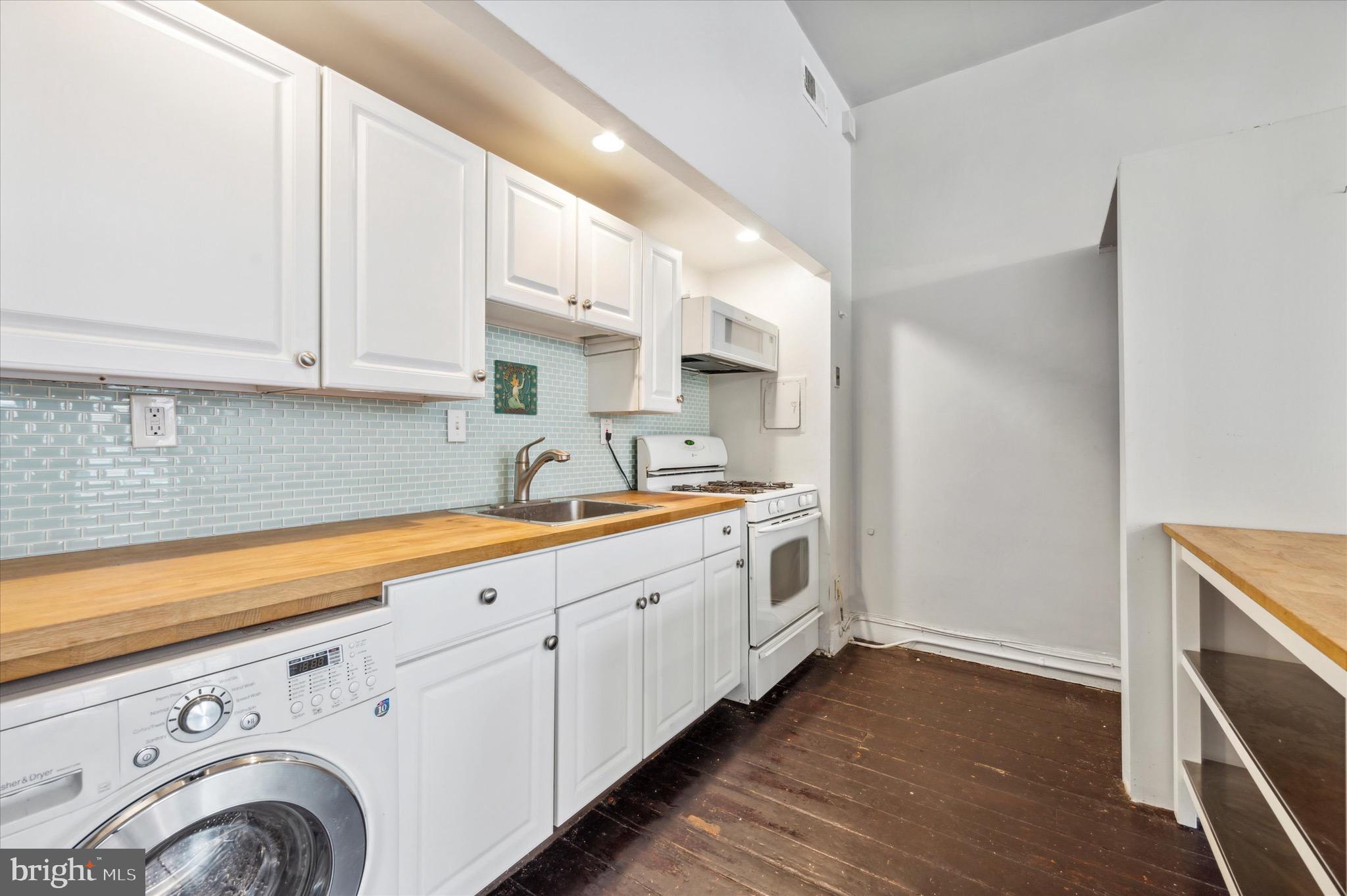 162 North 3rd Street, Unit 2 Philadelphia, PA 19106 - Photo 8 of 17 a kitchen with granite countertop white cabinets and sink