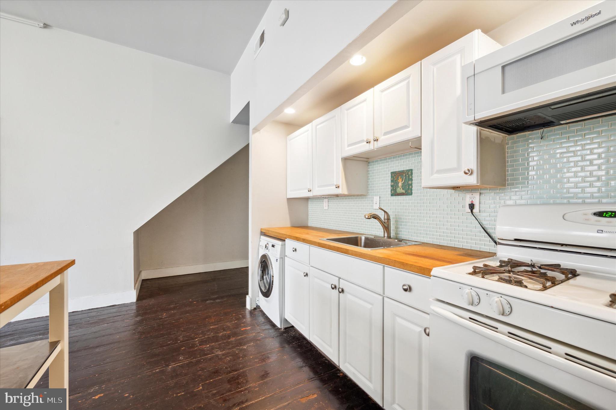 162 North 3rd Street, Unit 2 Philadelphia, PA 19106 - Photo 9 of 17 a kitchen with stainless steel appliances a sink dishwasher stove and cabinets