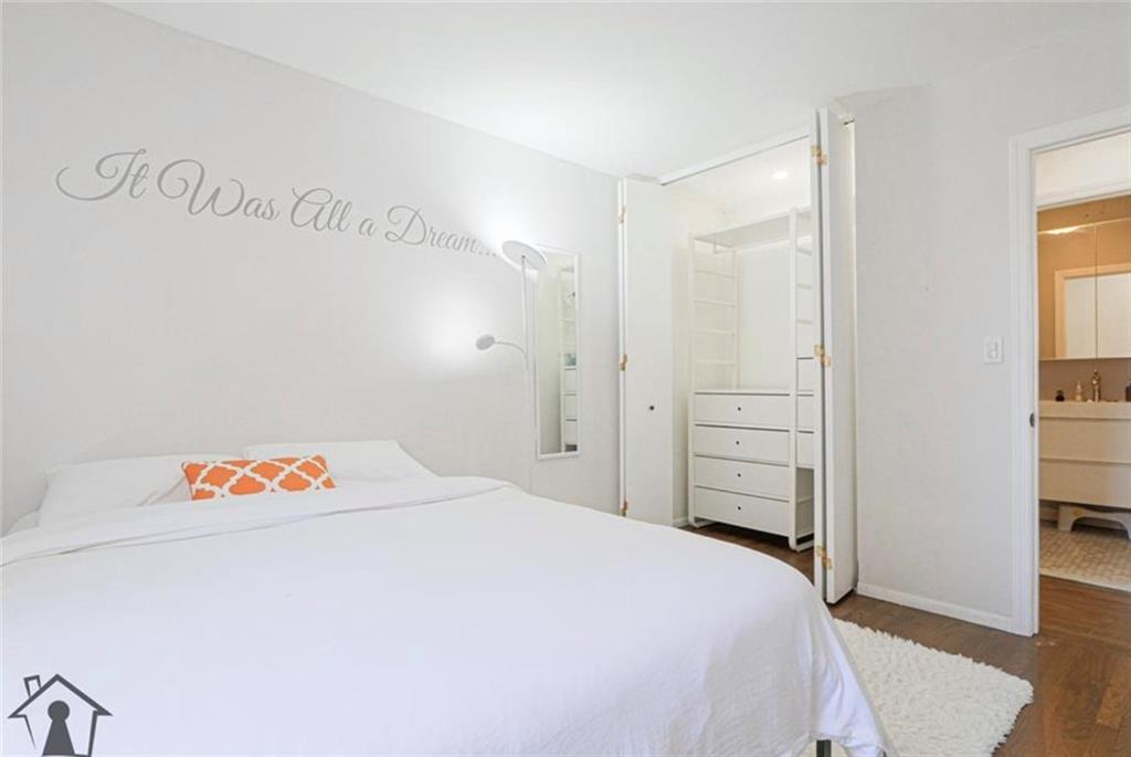 54 Erasmus Street, Unit 2D Brooklyn, NY 11226 - Photo 5 of 7 a bedroom with a bed and a book shelf