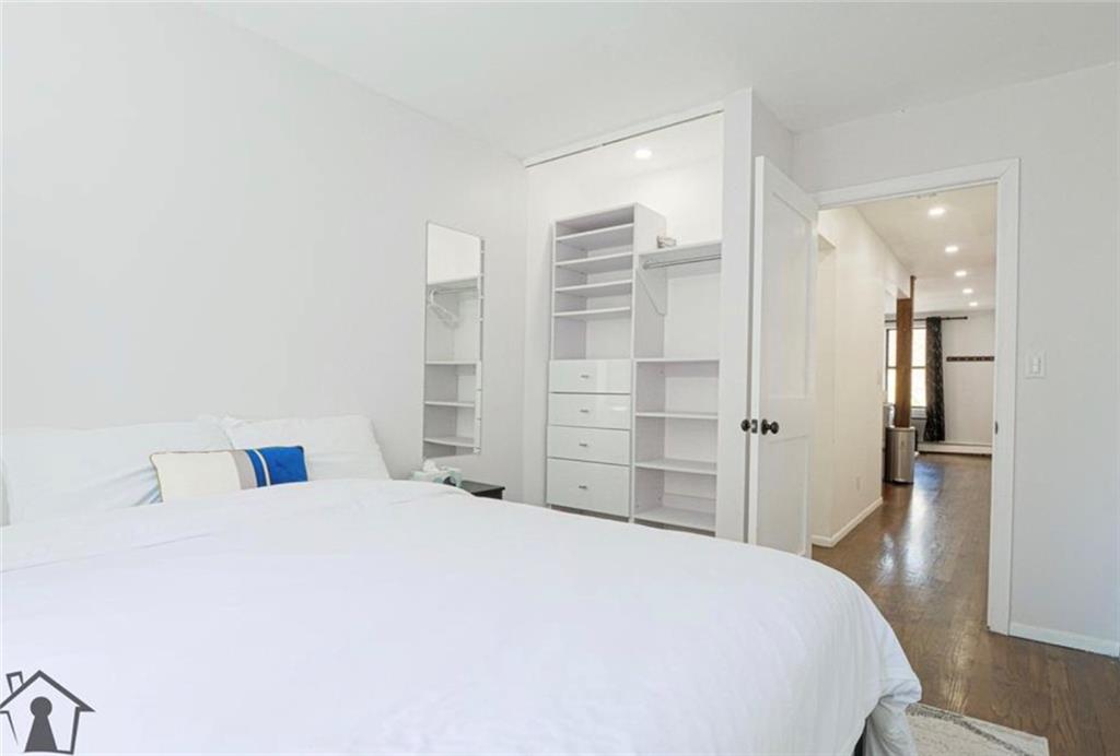 54 Erasmus Street, Unit 2D Brooklyn, NY 11226 - Photo 6 of 7 a large bedroom with a bed and closet
