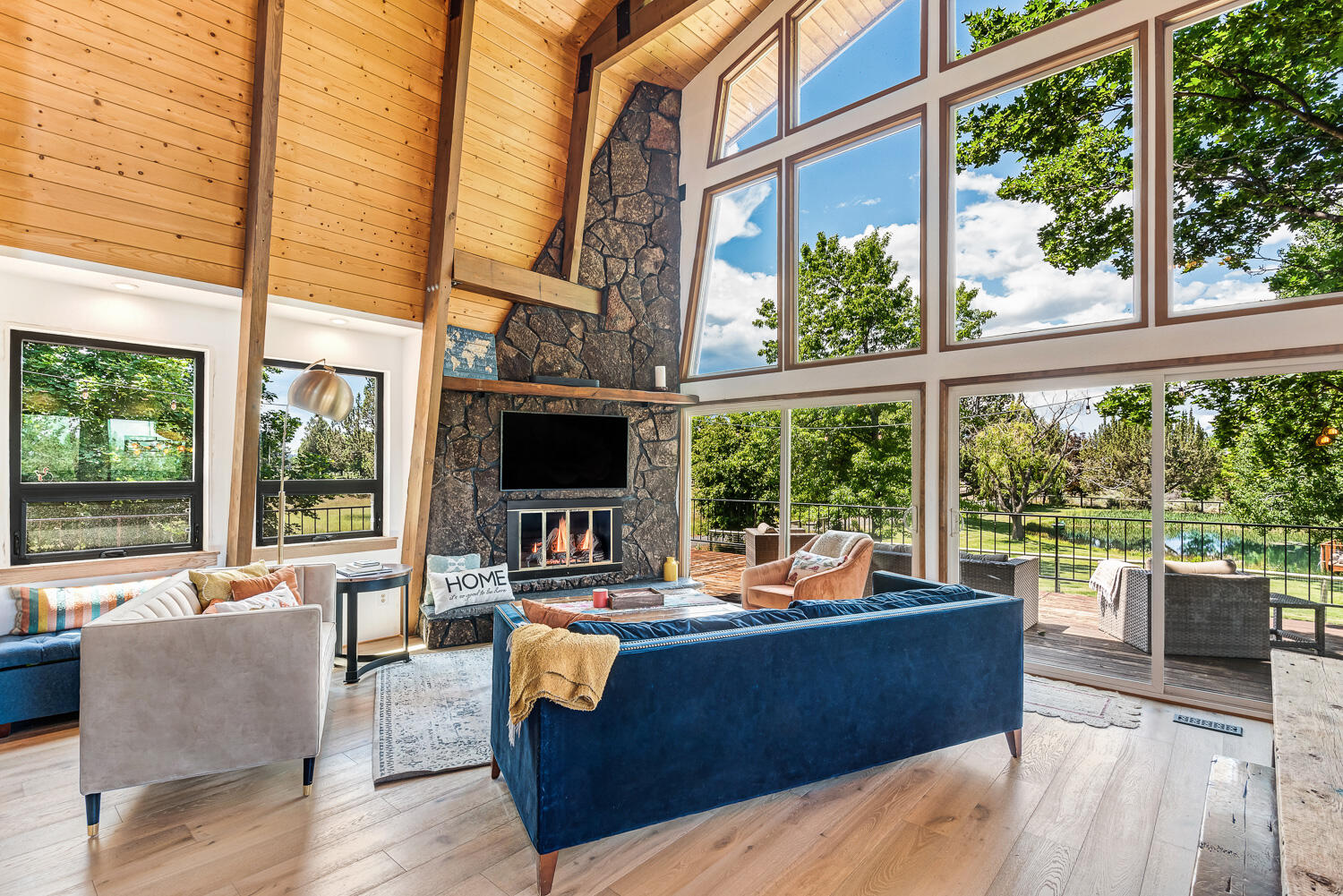 18970 Pinehurst Road Bend, OR 97703 - Photo 13 of 43 a living room with furniture and a floor to ceiling window
