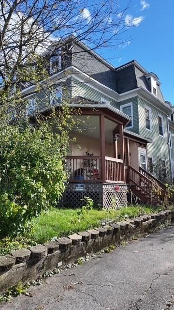 24 Catharine Street Worcester, MA 01605 - Photo 2 of 5 a front view of a house with a yard
