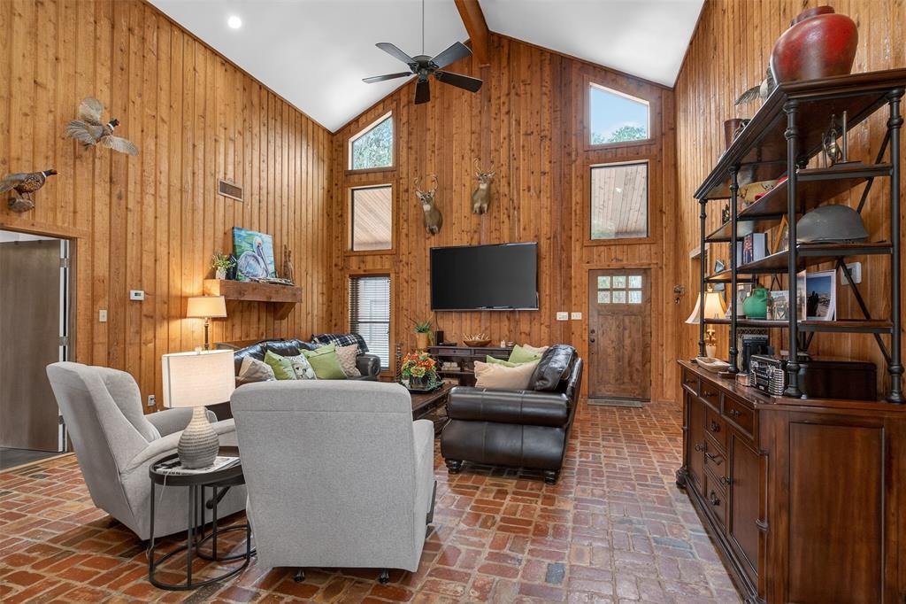 504 Moore Road Elm Grove, LA 71051 - Photo 11 of 37 a living room with furniture fireplace and a flat screen tv