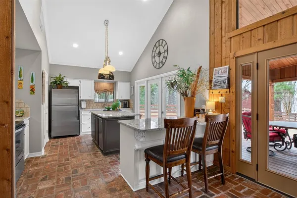a kitchen with a table and chairs
