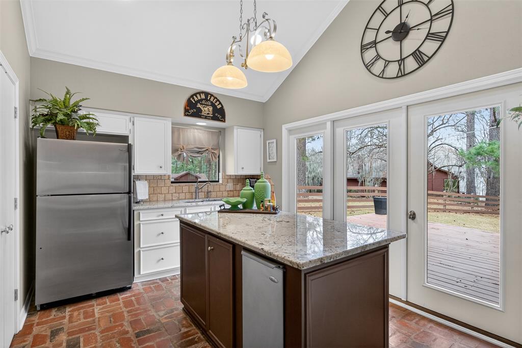504 Moore Road Elm Grove, LA 71051 - Photo 16 of 37 a kitchen with stainless steel appliances granite countertop a refrigerator and a stove top oven