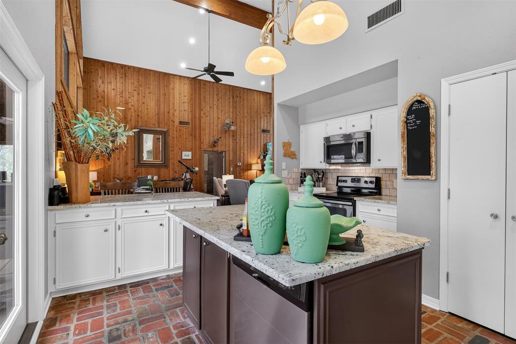 504 Moore Road Elm Grove, LA 71051 - Photo 18 of 37 a kitchen with cabinets a sink and appliances