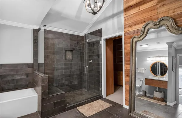 a bathroom with a shower a mirror and a shower