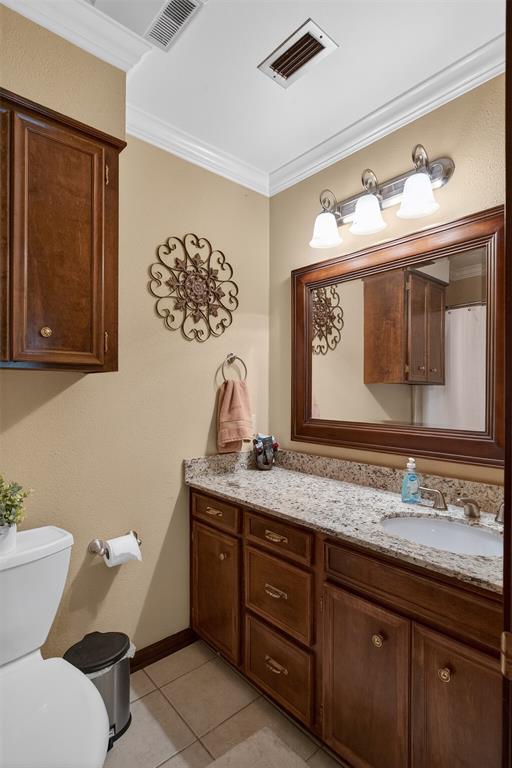 504 Moore Road Elm Grove, LA 71051 - Photo 28 of 37 a bathroom with a toilet sink and mirror