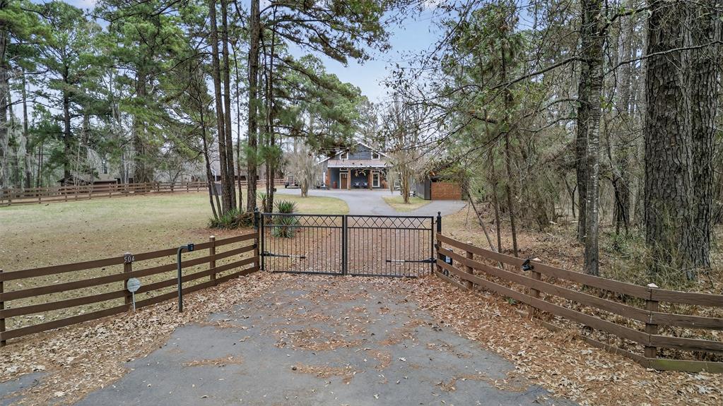 504 Moore Road Elm Grove, LA 71051 - Photo 3 of 37 a white house that has a tree in front of it