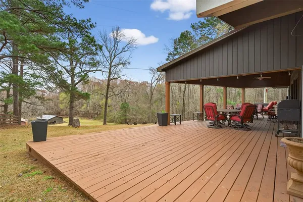 a view of a backyard with sitting area
