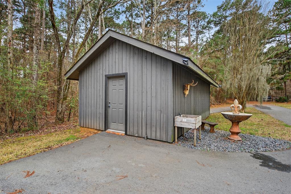 504 Moore Road Elm Grove, LA 71051 - Photo 34 of 37 a backyard of a house with yard and outdoor seating