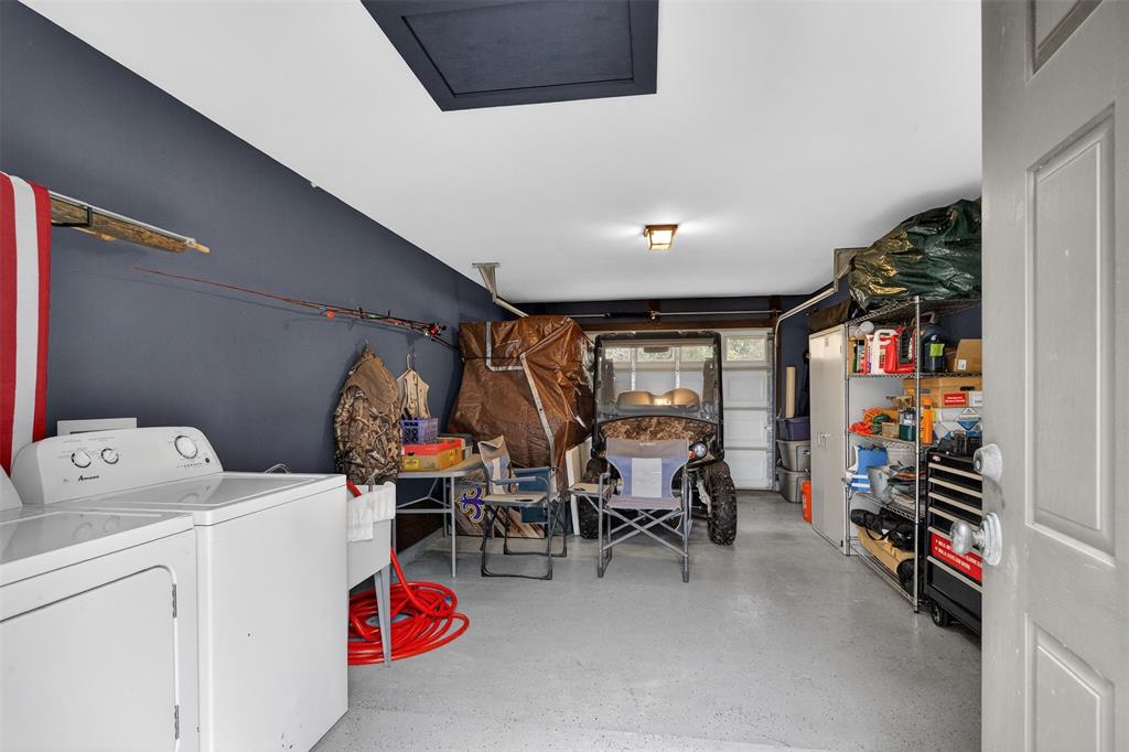 504 Moore Road Elm Grove, LA 71051 - Photo 35 of 37 a storage room with washer and dryer