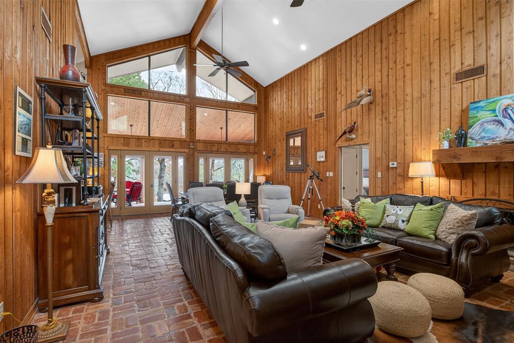 504 Moore Road Elm Grove, LA 71051 - Photo 9 of 37 a living room with furniture a fireplace and a large window