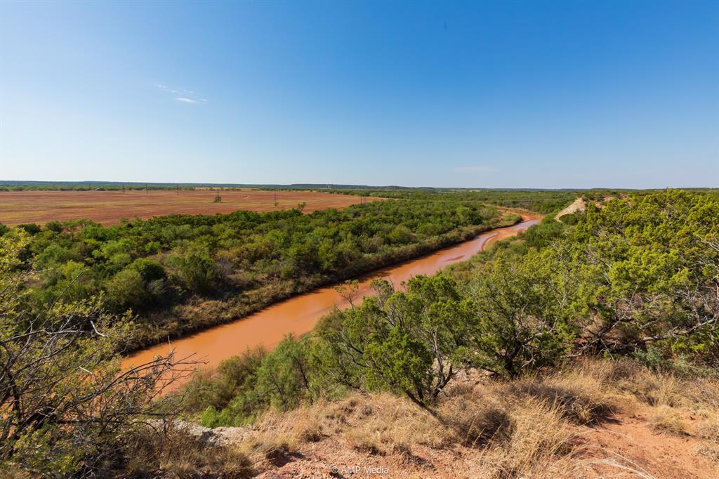 107 C R 107 Aspermont, TX 79502 - Photo 2 of 40 a view of a yard with a lake view