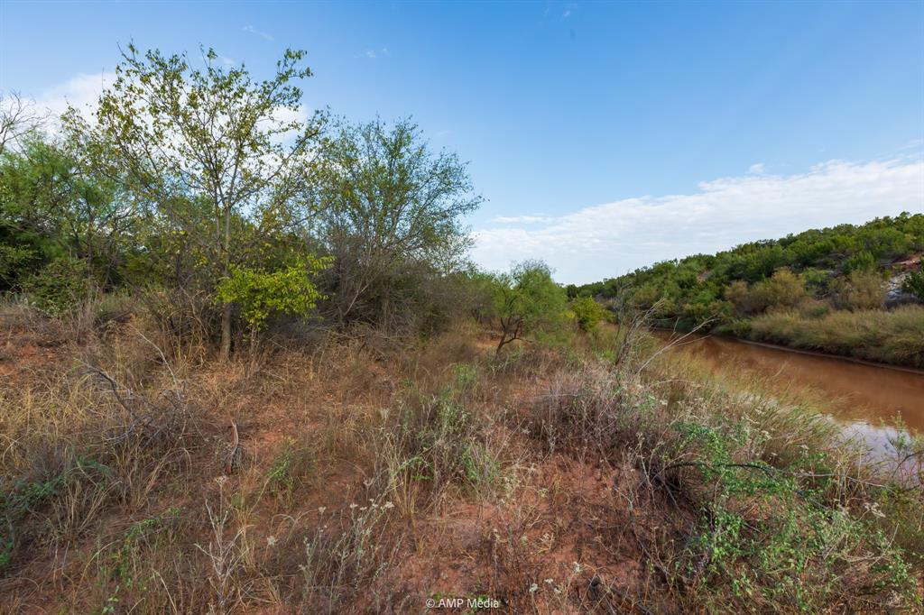 107 C R 107 Aspermont, TX 79502 - Photo 30 of 40 a view of a lake with top of house