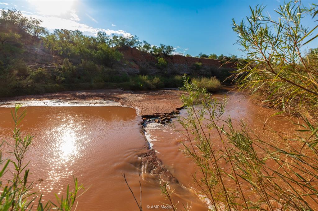 107 C R 107 Aspermont, TX 79502 - Photo 5 of 40 a view of a lake with a yard