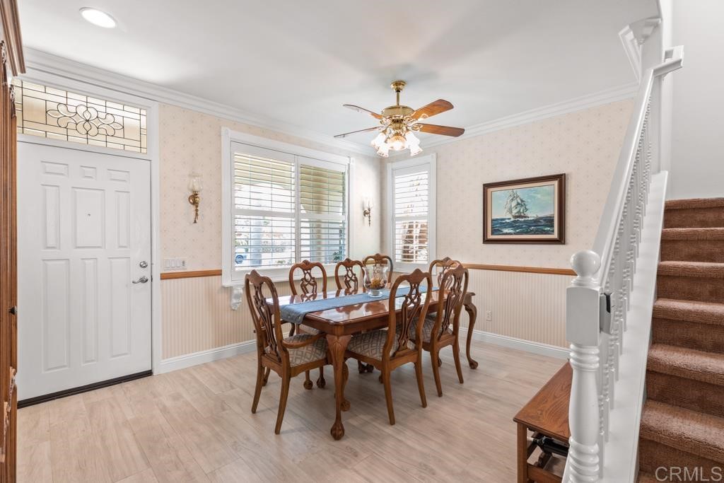 7301 Seafarer Place Carlsbad, CA 92011 - Photo 11 of 33 a view of a a dining room with furniture window and wooden floor