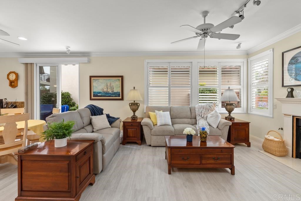 7301 Seafarer Place Carlsbad, CA 92011 - Photo 17 of 33 a living room with furniture and windows