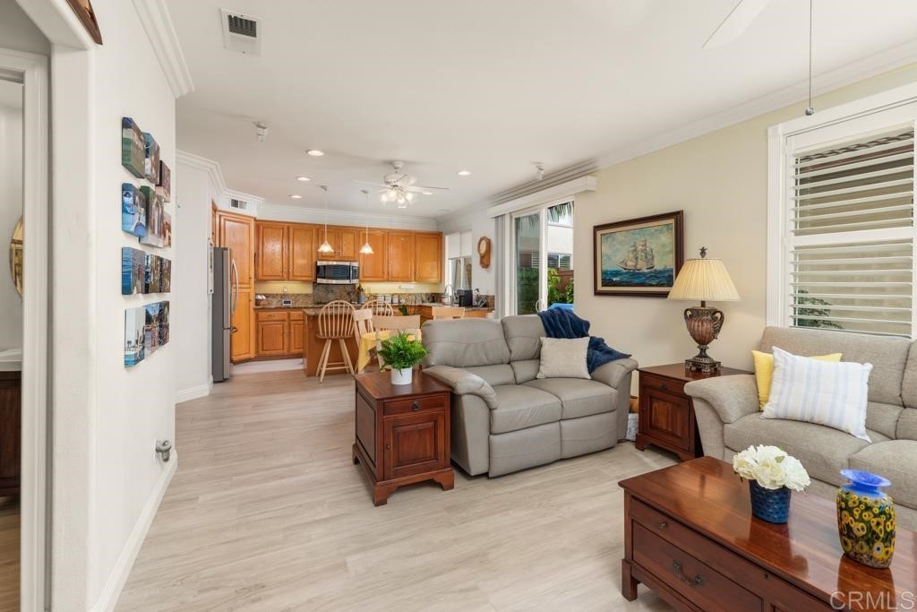 7301 Seafarer Place Carlsbad, CA 92011 - Photo 18 of 33 a living room with furniture and a flat screen tv