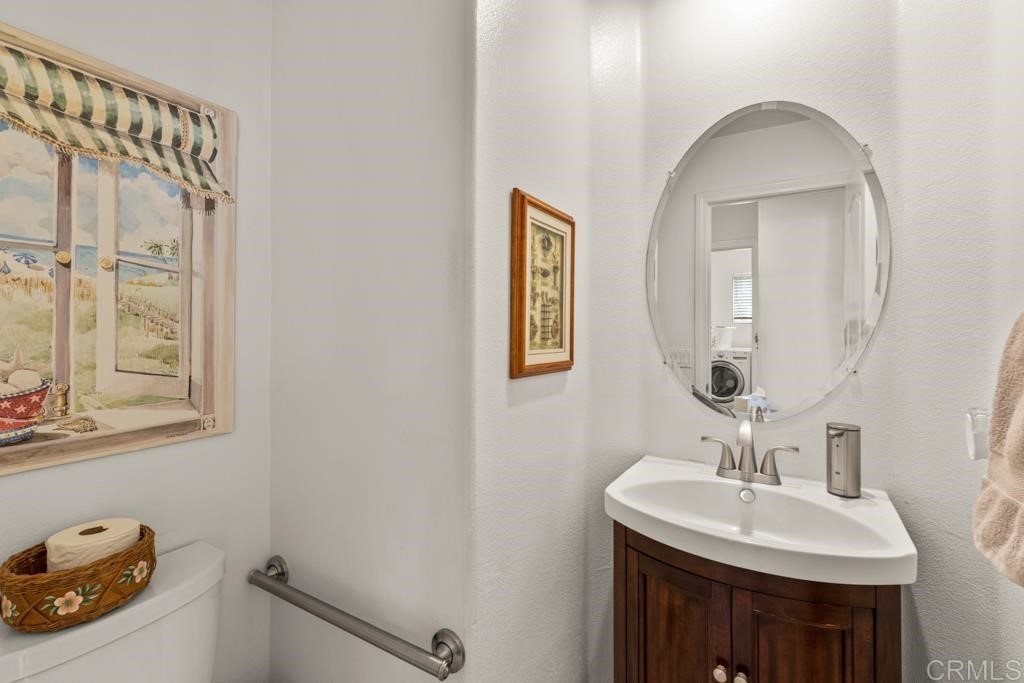 7301 Seafarer Place Carlsbad, CA 92011 - Photo 19 of 33 a bathroom with a sink and a mirror