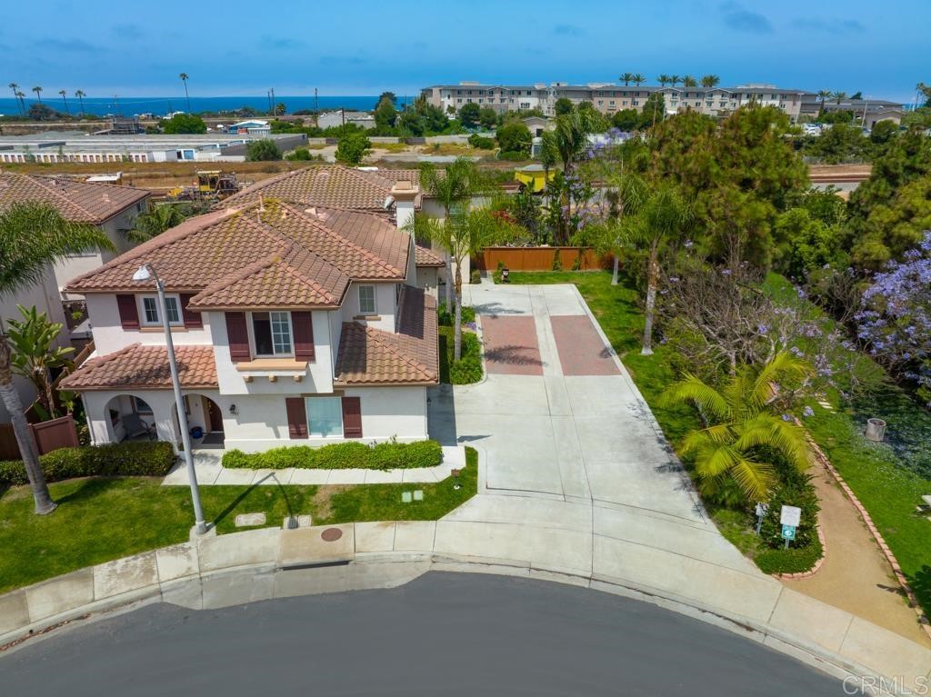 7301 Seafarer Place Carlsbad, CA 92011 - Photo 2 of 33 an aerial view of a house with a garden and lake view