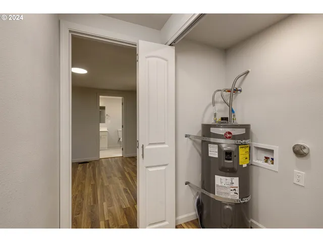 a view of hallway with wooden floor
