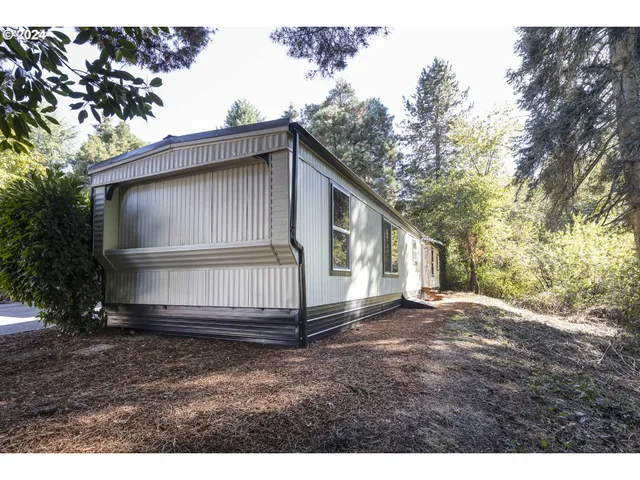 a back yard of a house with a yard