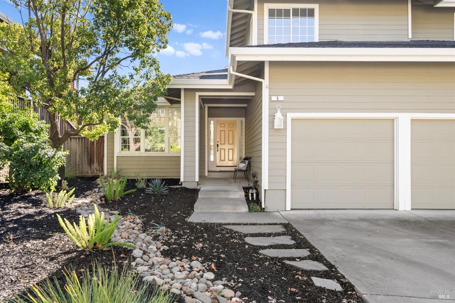 a front view of a house with a chair