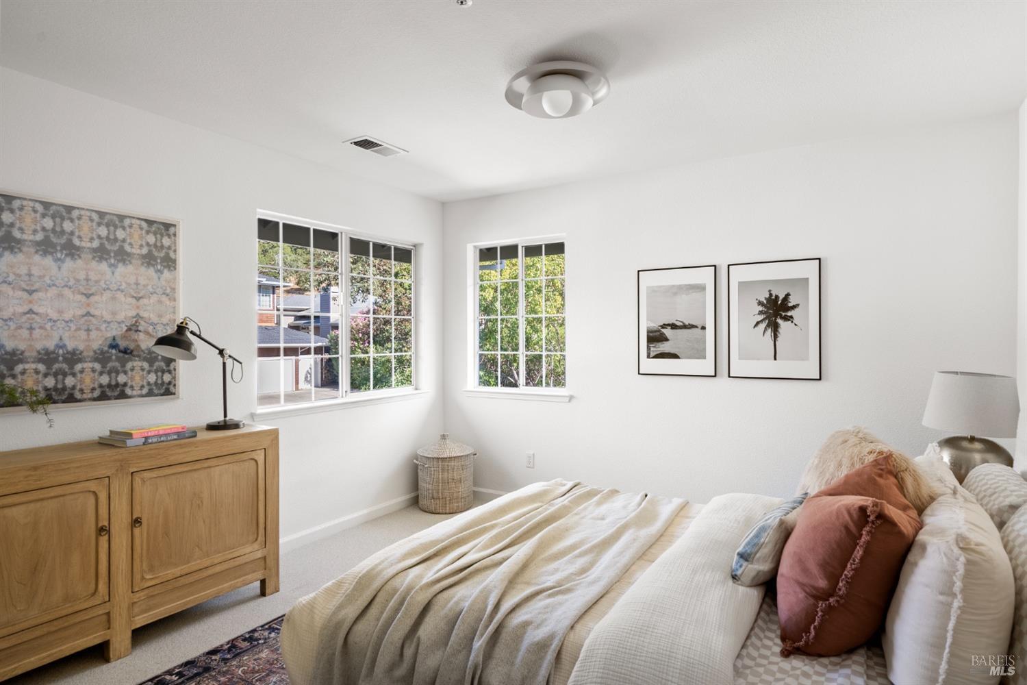 8 Pacific Drive Novato, CA 94949 - Photo 28 of 37 a bedroom with a bed and a window