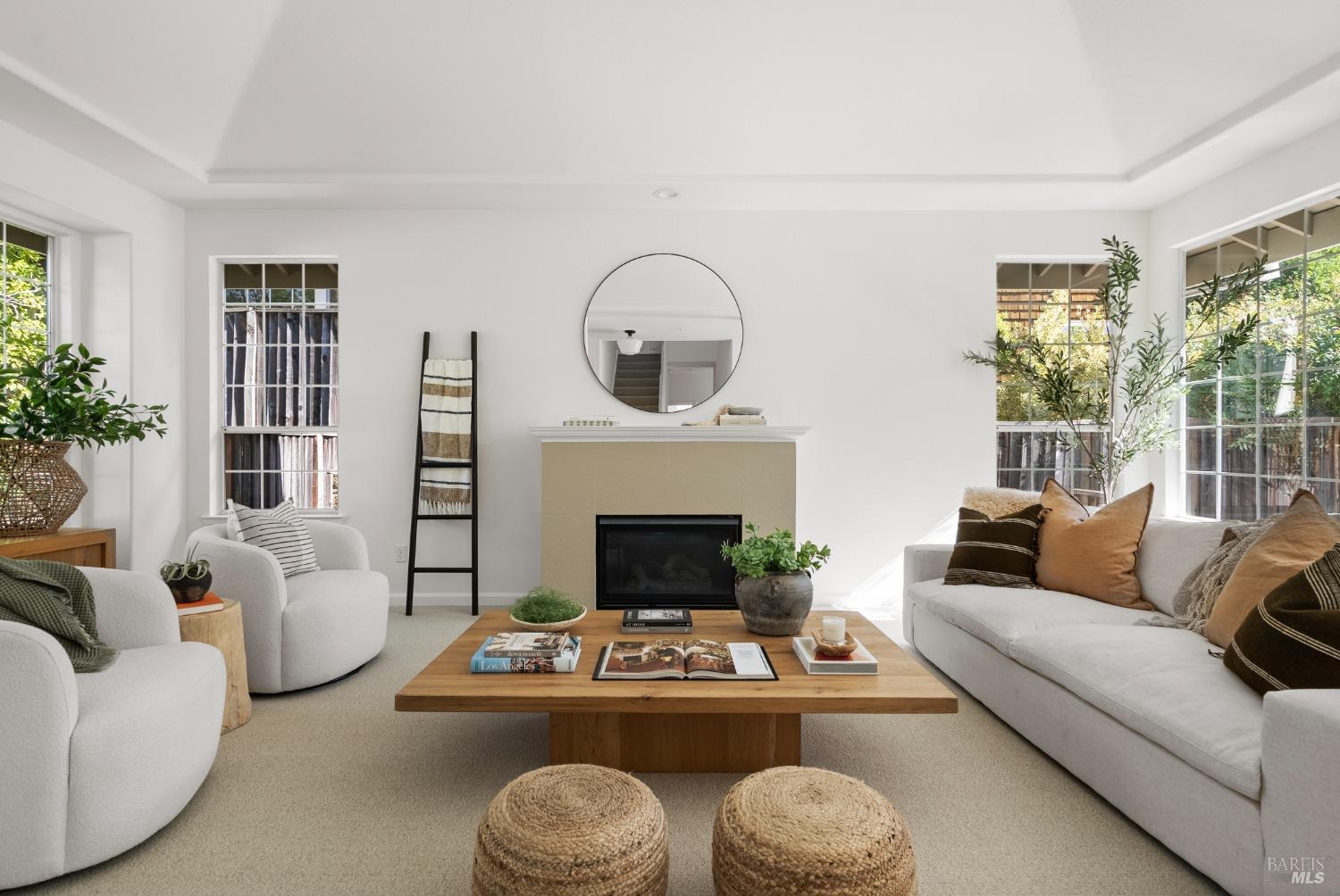 8 Pacific Drive Novato, CA 94949 - Photo 4 of 37 a living room with furniture a fireplace and windows