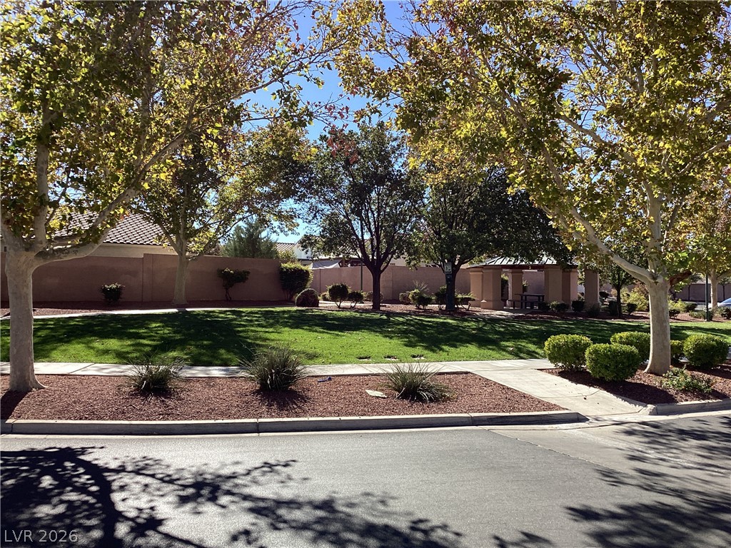 2135 Hidden Ranch Terrace Henderson, NV 89052 - Photo 27 of 27 A community greenspace with mature trees, a manicured lawn, and a charming gazebo offers a serene retreat.