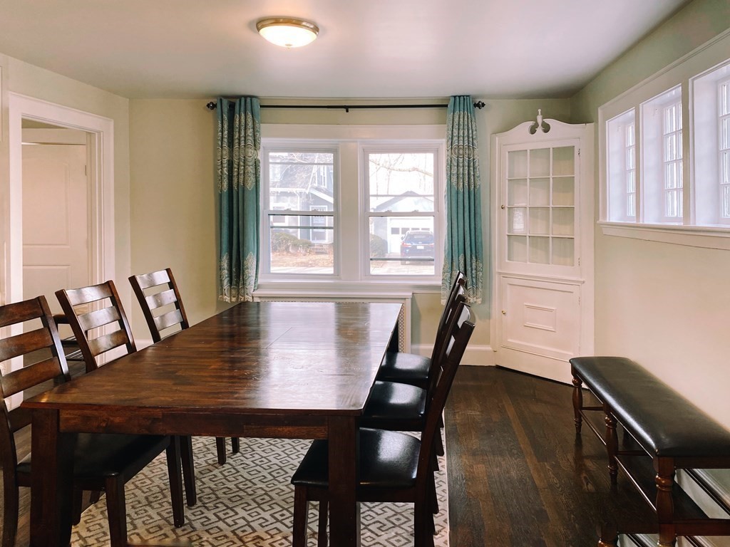 64 Royce Road Newton, MA 02459 - Photo 11 of 31 a view of a dining room with furniture window and wooden floor