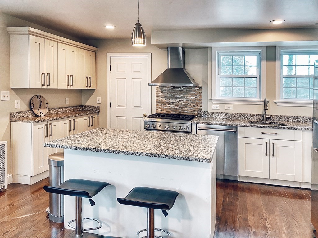 64 Royce Road Newton, MA 02459 - Photo 2 of 31 a kitchen with granite countertop kitchen island cabinets and appliances