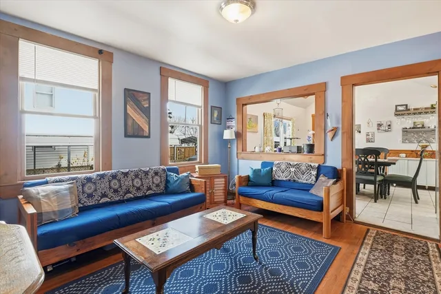 a living room with furniture and a rug