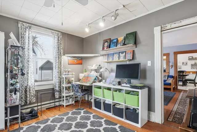 a room with furniture a rug and a flat screen tv
