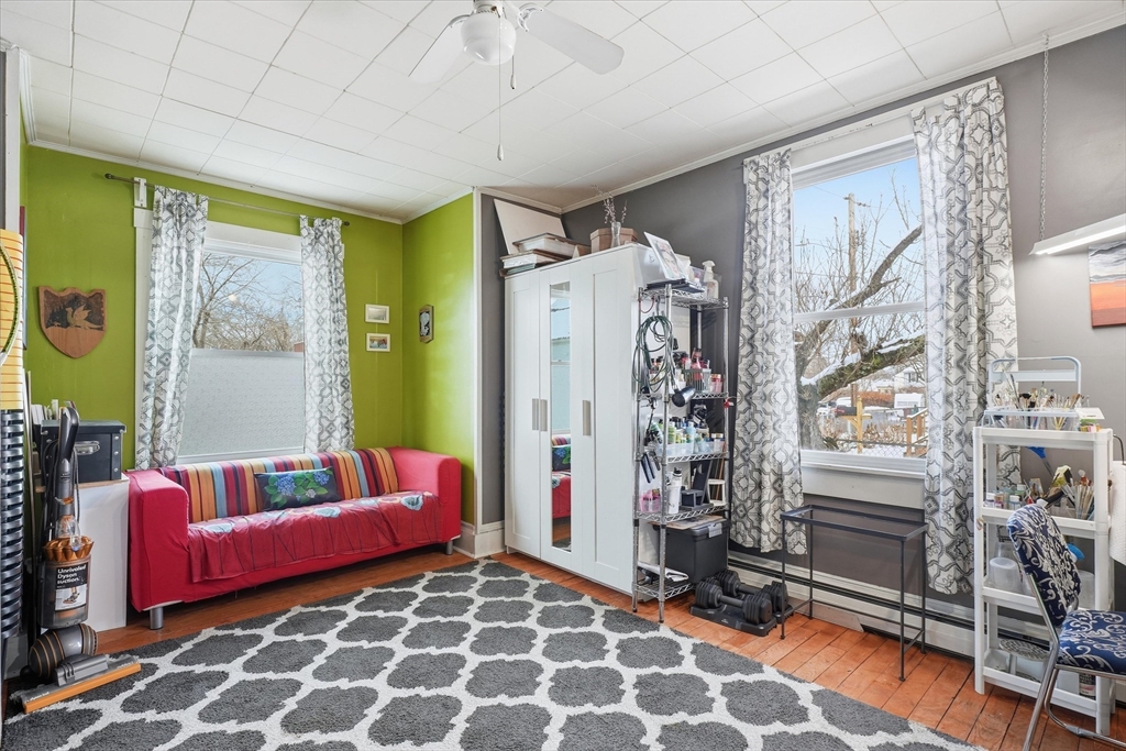 59 Fay Street Lowell, MA 01852 - Photo 14 of 33 a living room with furniture and a flat screen tv